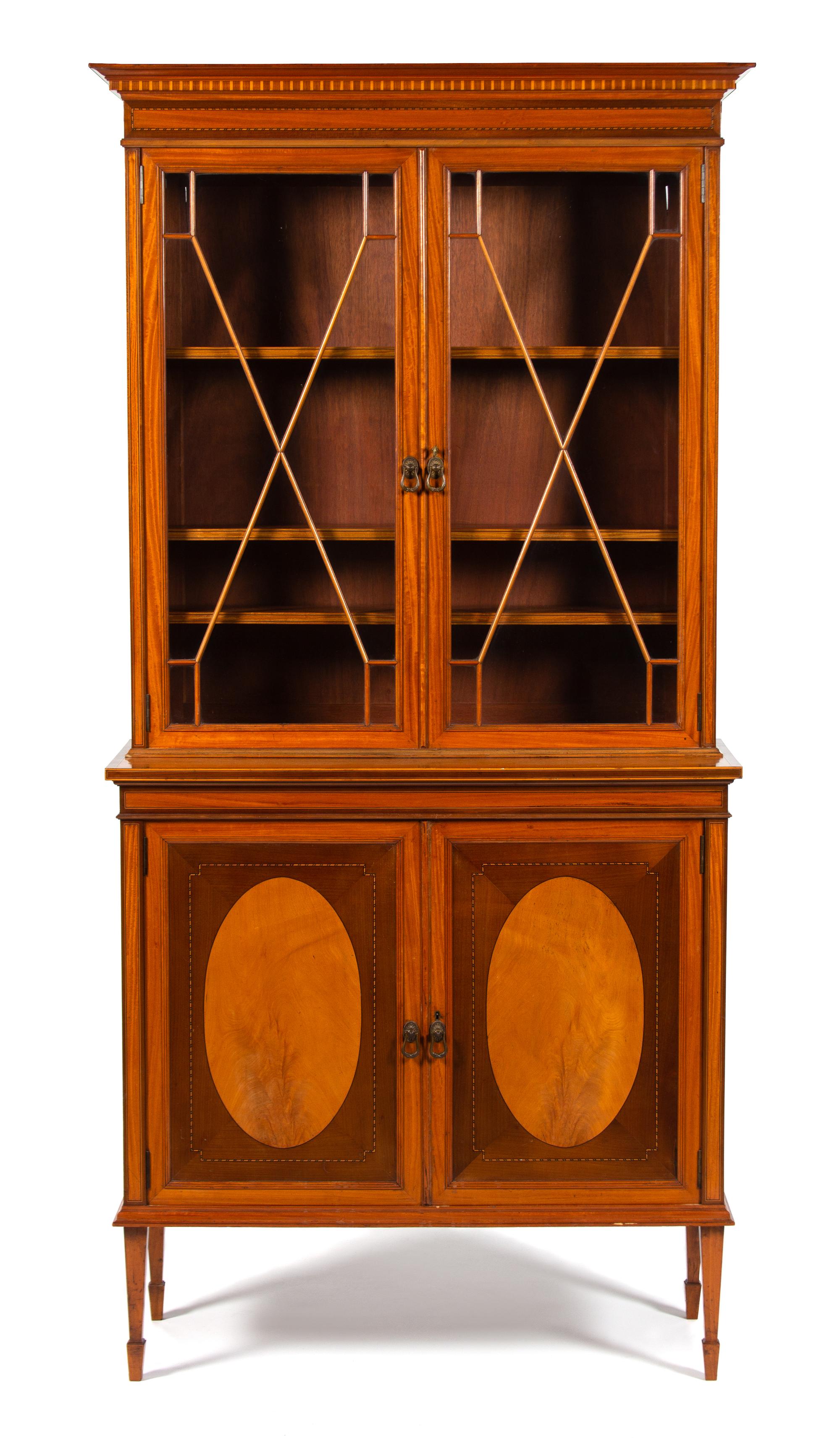 An Edwardian Inlaid Satinwood Breakfront Bookcase Height 82 1/2 x width 39 1/2 x depth 16 1/4 inches. — 19TH CENTURY
