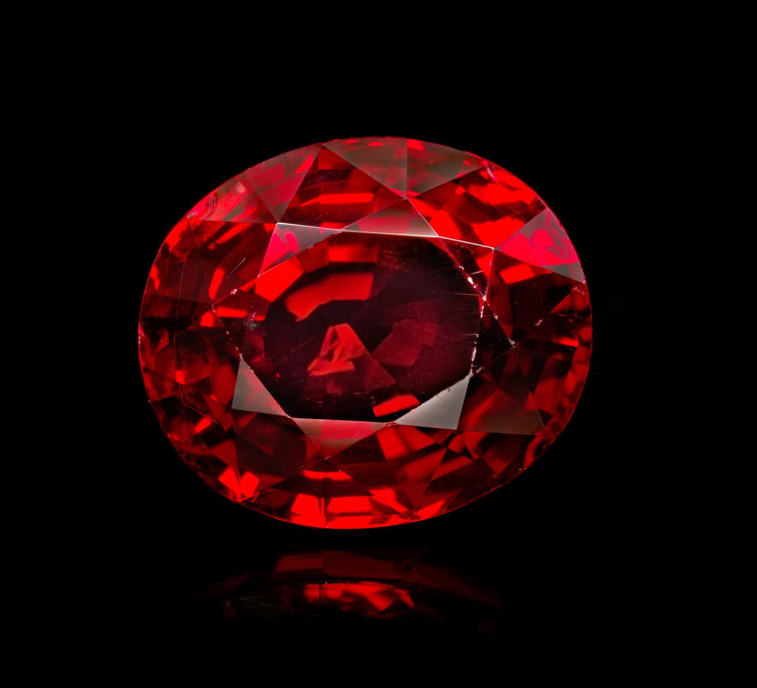 An 11.58 Carat Oval Mixed Cut Burmese Red Spinel, 4.30 dwts. (with setting)