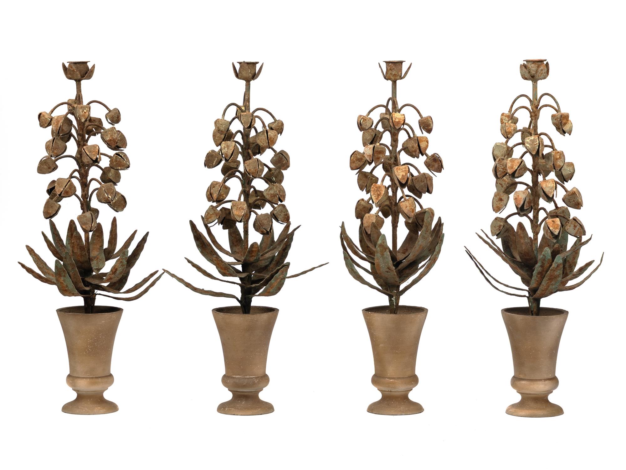 A Set of Four Topiary-Form Candlesticks