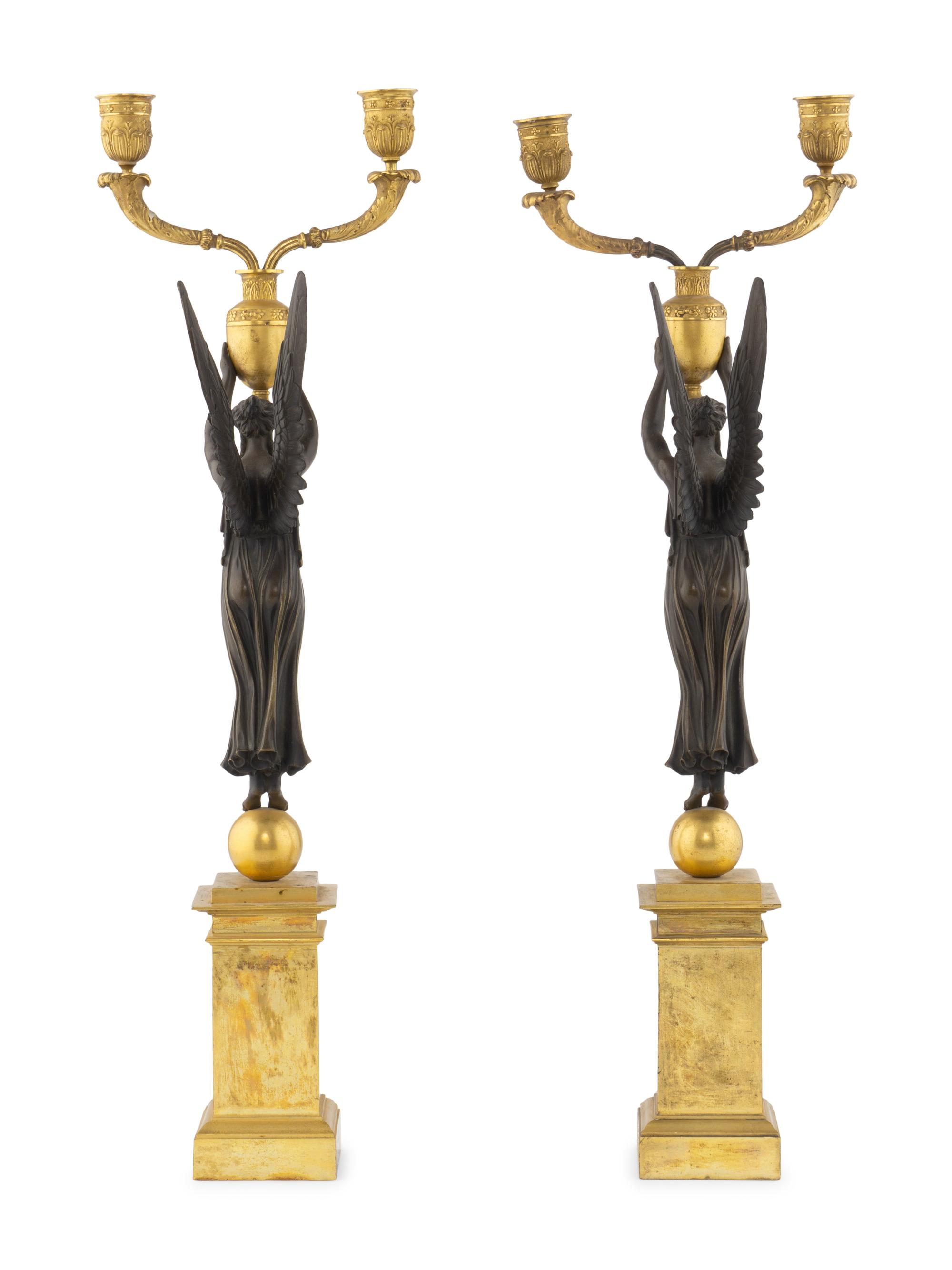 A Pair of Empire Style Gilt and Patinated Bronze Figural Two-Light Candelabra