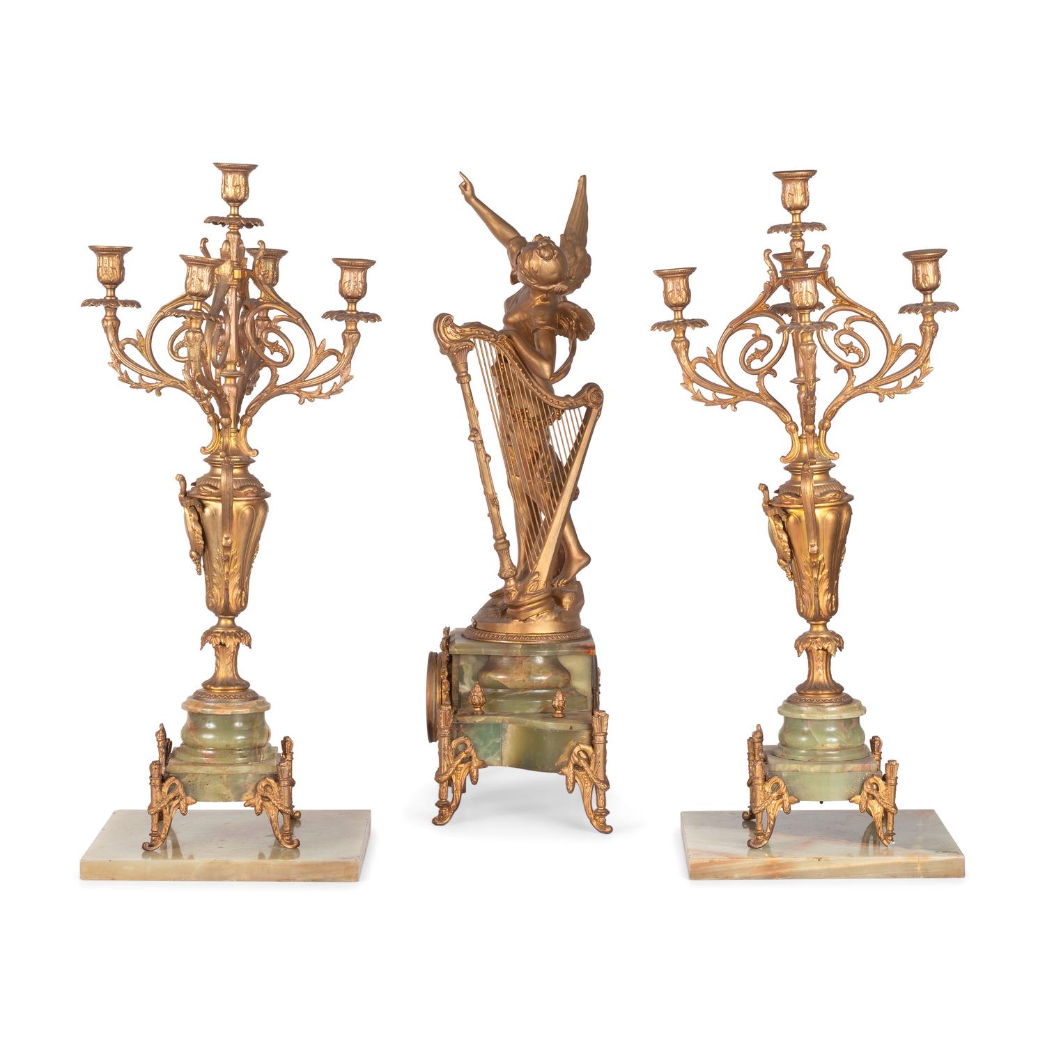 A Neoclassical Gilt Metal and Onyx Clock Garniture