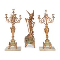 A Neoclassical Gilt Metal and Onyx Clock Garniture
