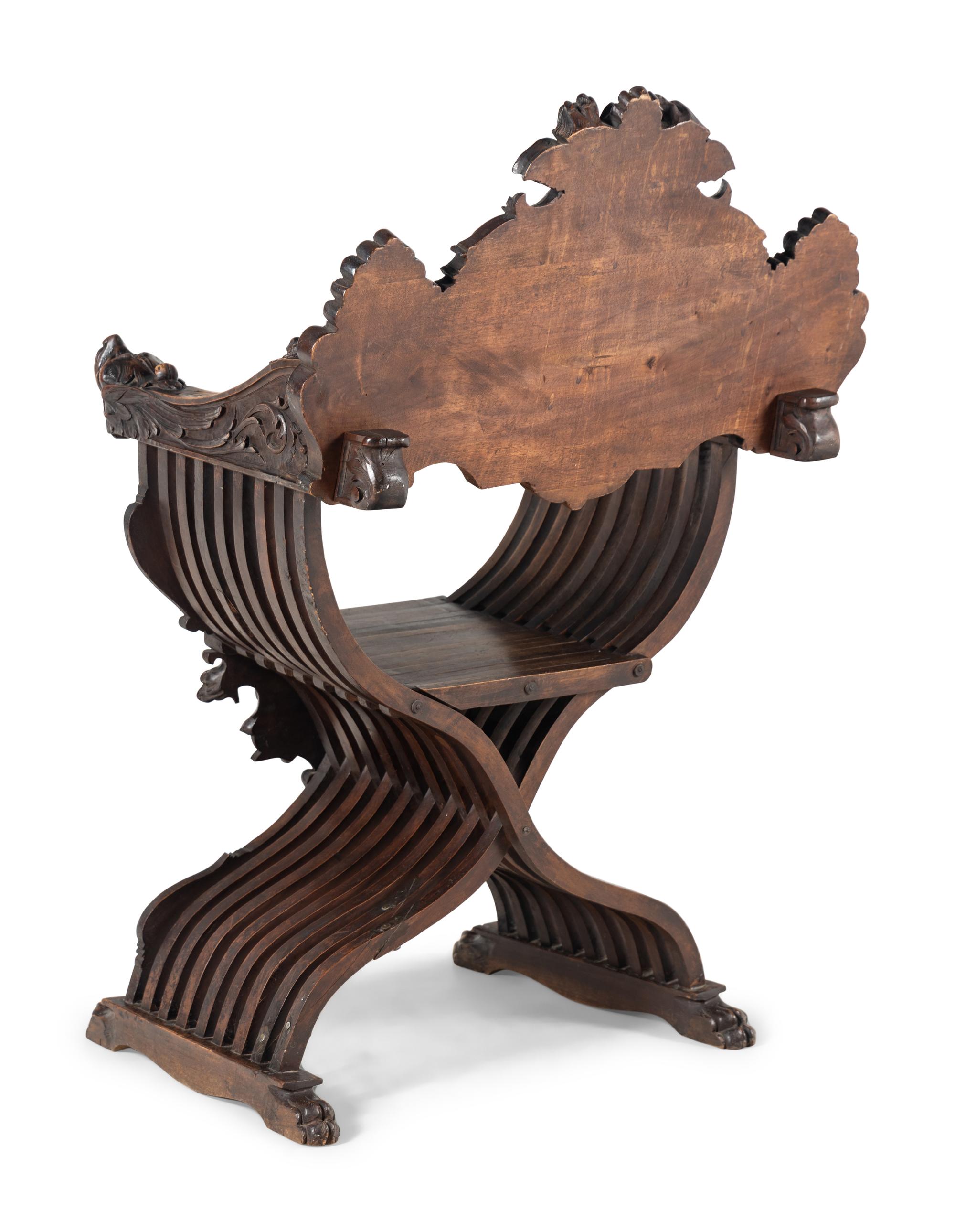 A Renaissance Revival Carved Walnut Savonarola Chair