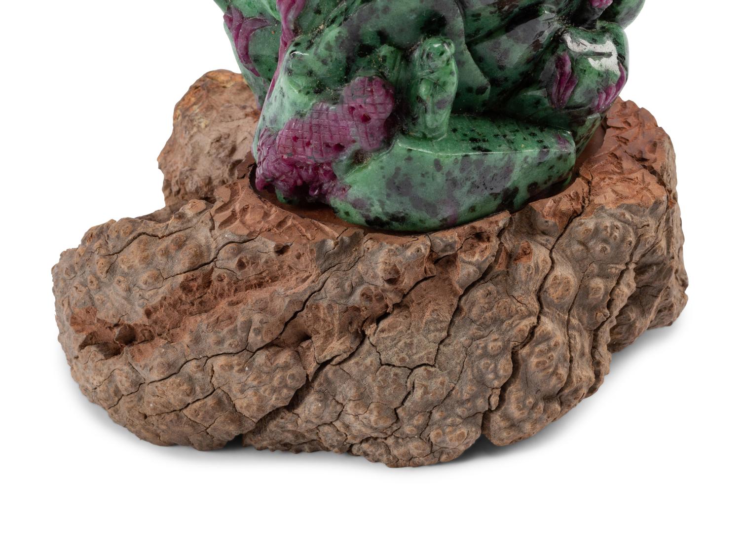 A Chinese Carved Ruby Zoisite Boulder on a Wood Base