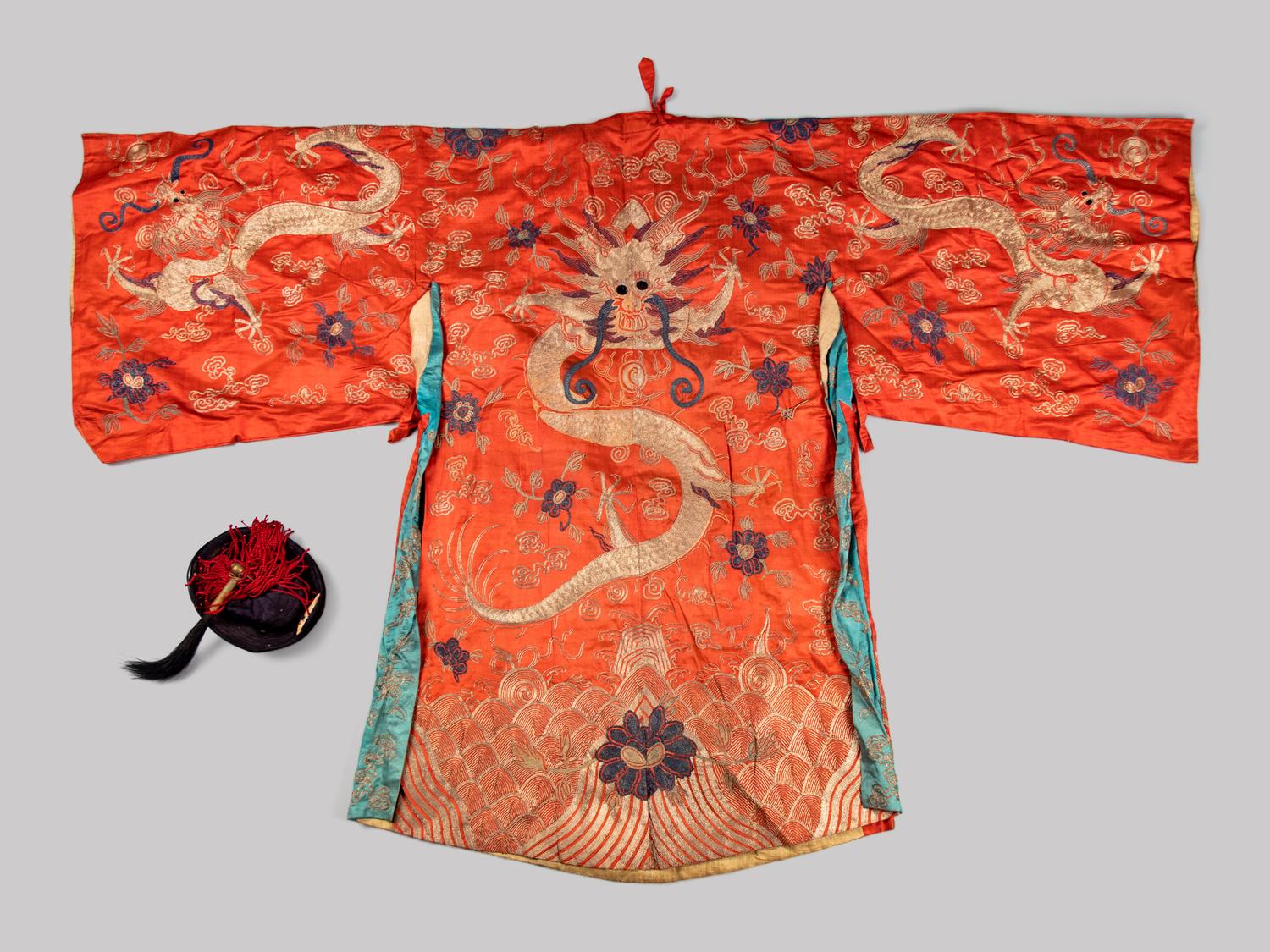 An Embroidered Silk Theatrical 'Dragon' Robe and an Official Hat