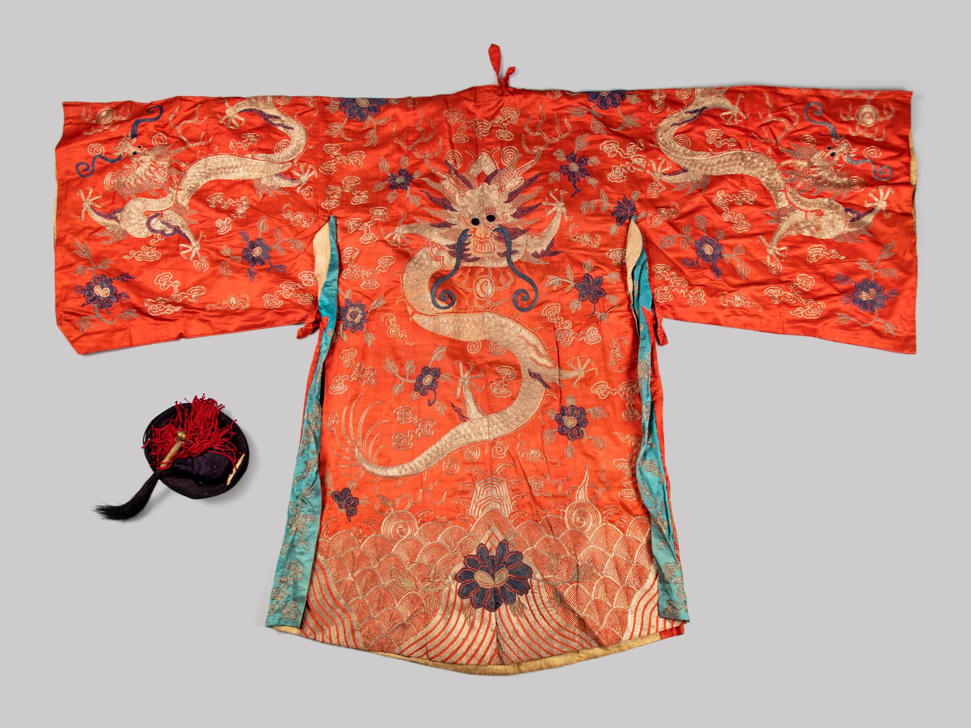 An Embroidered Silk Theatrical 'Dragon' Robe and an Official Hat