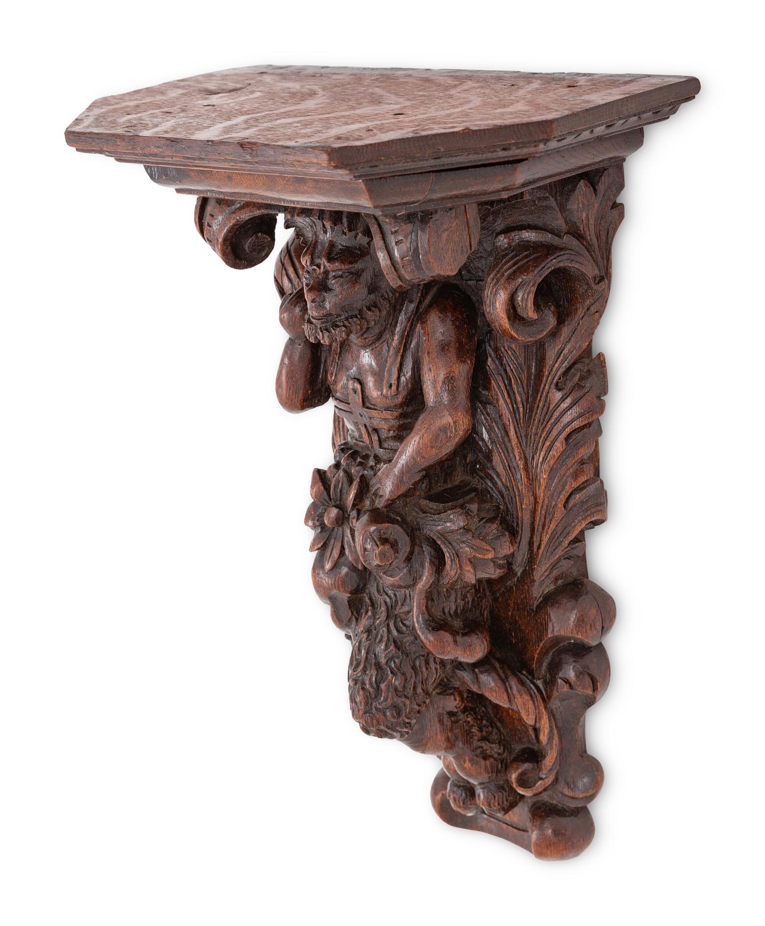 A Swiss Black Forest Carved Wall Bracket