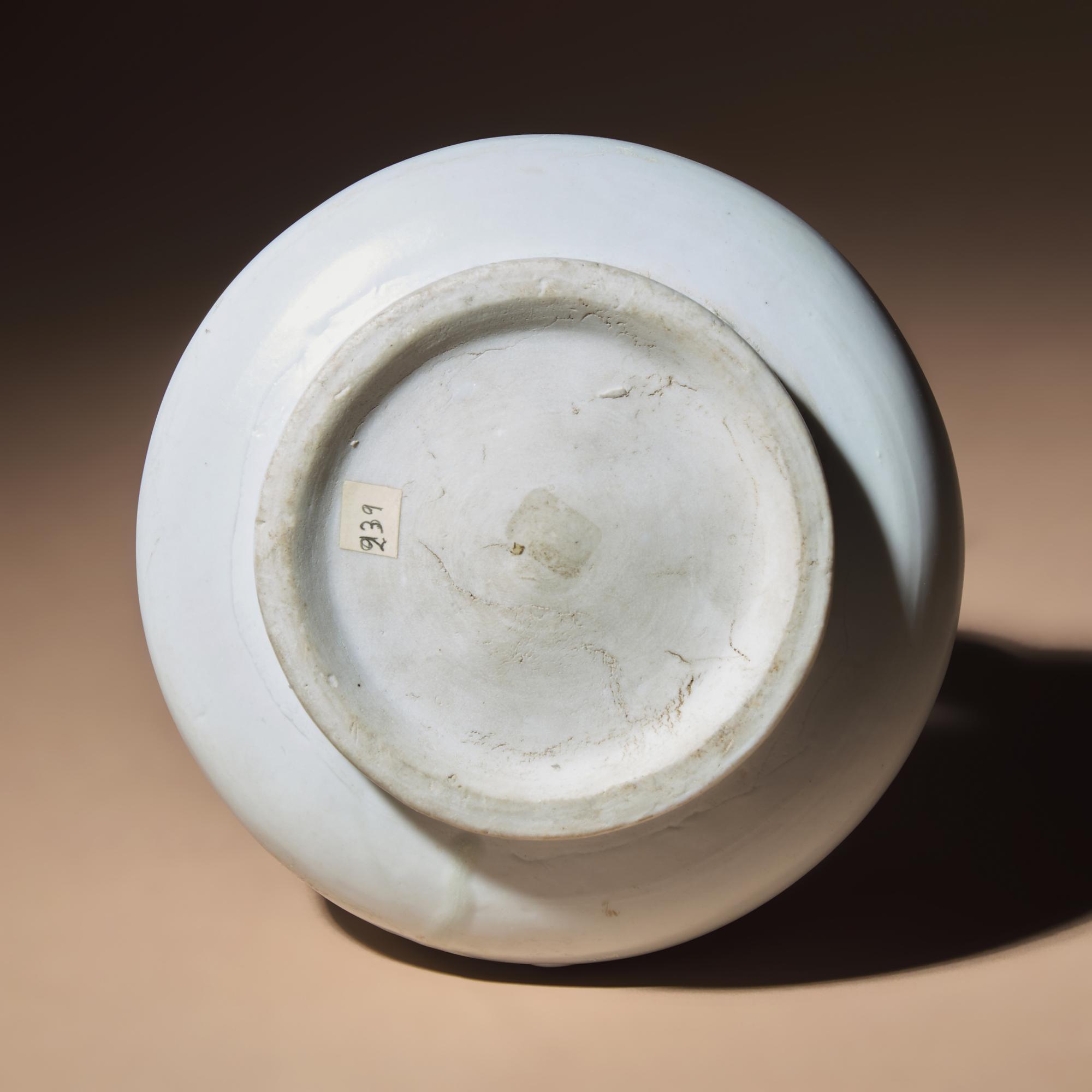 A Chinese White Glazed Molded Porcelain 'Floral' Jar, Mid Ming Dynasty, 15th Century — 明中期 白釉模印纏枝花卉敞口罐
