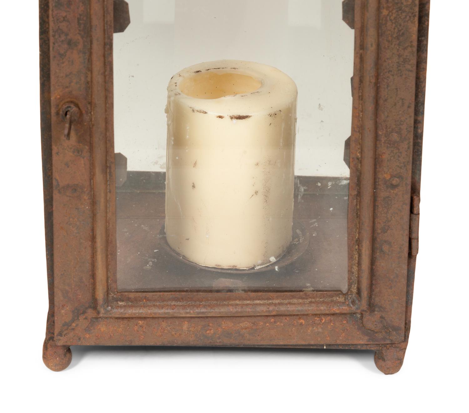 A Set of Four Weathered Steel Lanterns