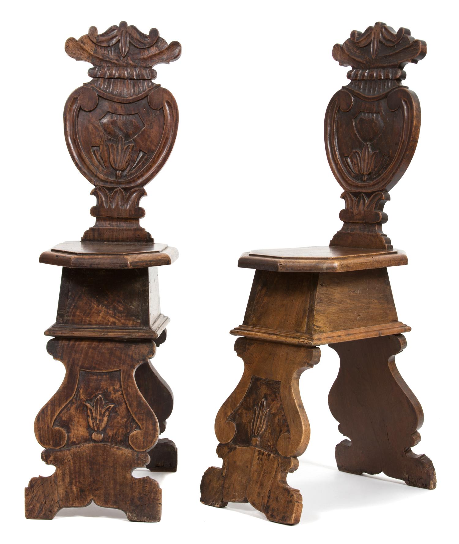 A Pair of Italian Carved Oak Sgabello Hall Chairs Height 42 inches. — 18TH CENTURY