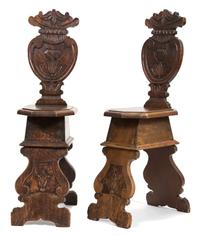 A Pair of Italian Carved Oak Sgabello Hall Chairs Height 42 inches. — 18TH CENTURY