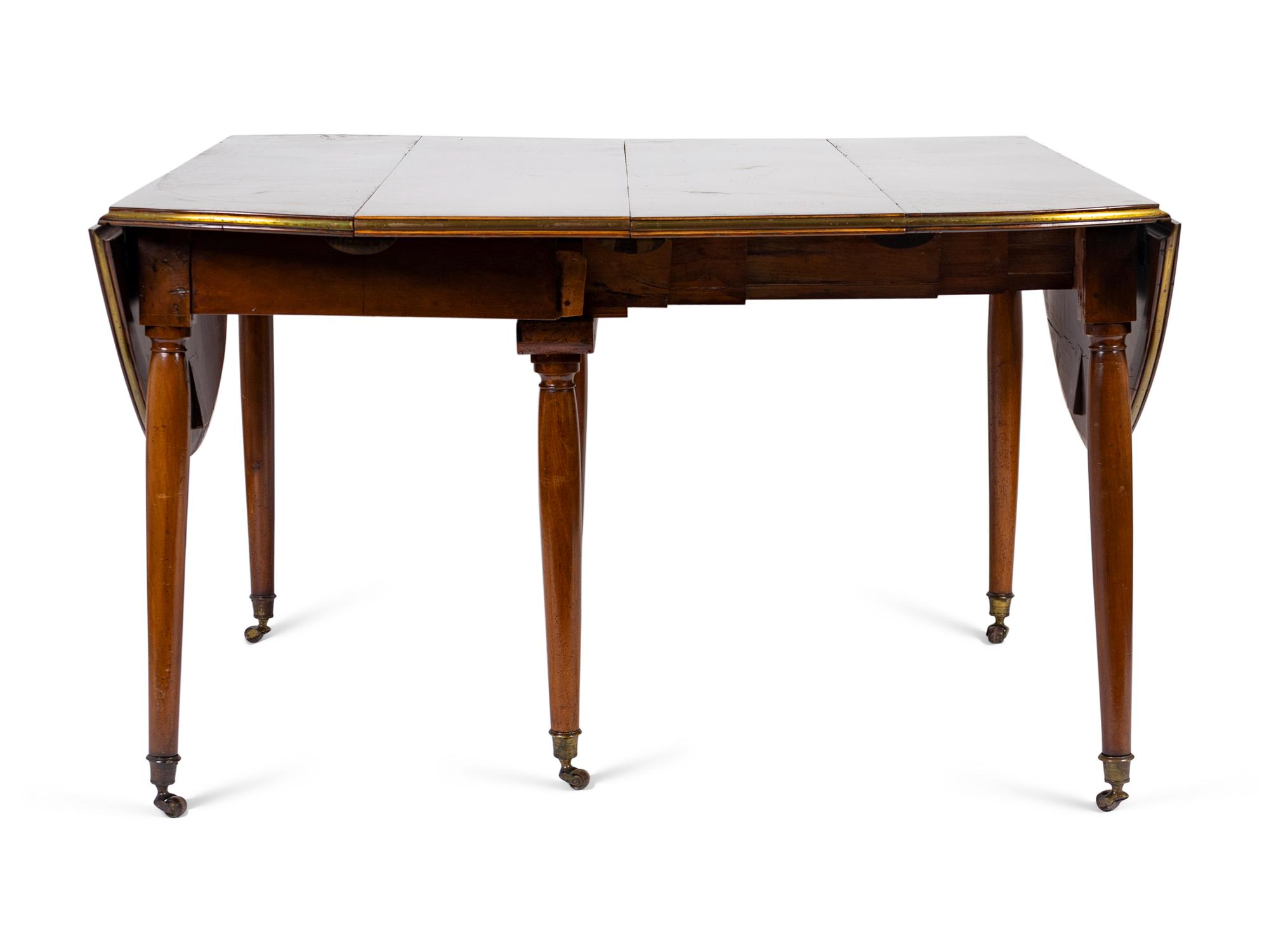 A Louis XVI Mahogany and Brass Banded Extension Dining Table — CIRCA 1790