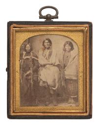 [NATIVE AMERICANS]. MCKENNY, A.S., photographer. CDV of Ute Indians in a studio setting. Blackhawk, Colorado Territory. Ca 1870.