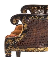 A Pair of William IV Parcel Gilt Japanned and Cane Upholstered Armchairs