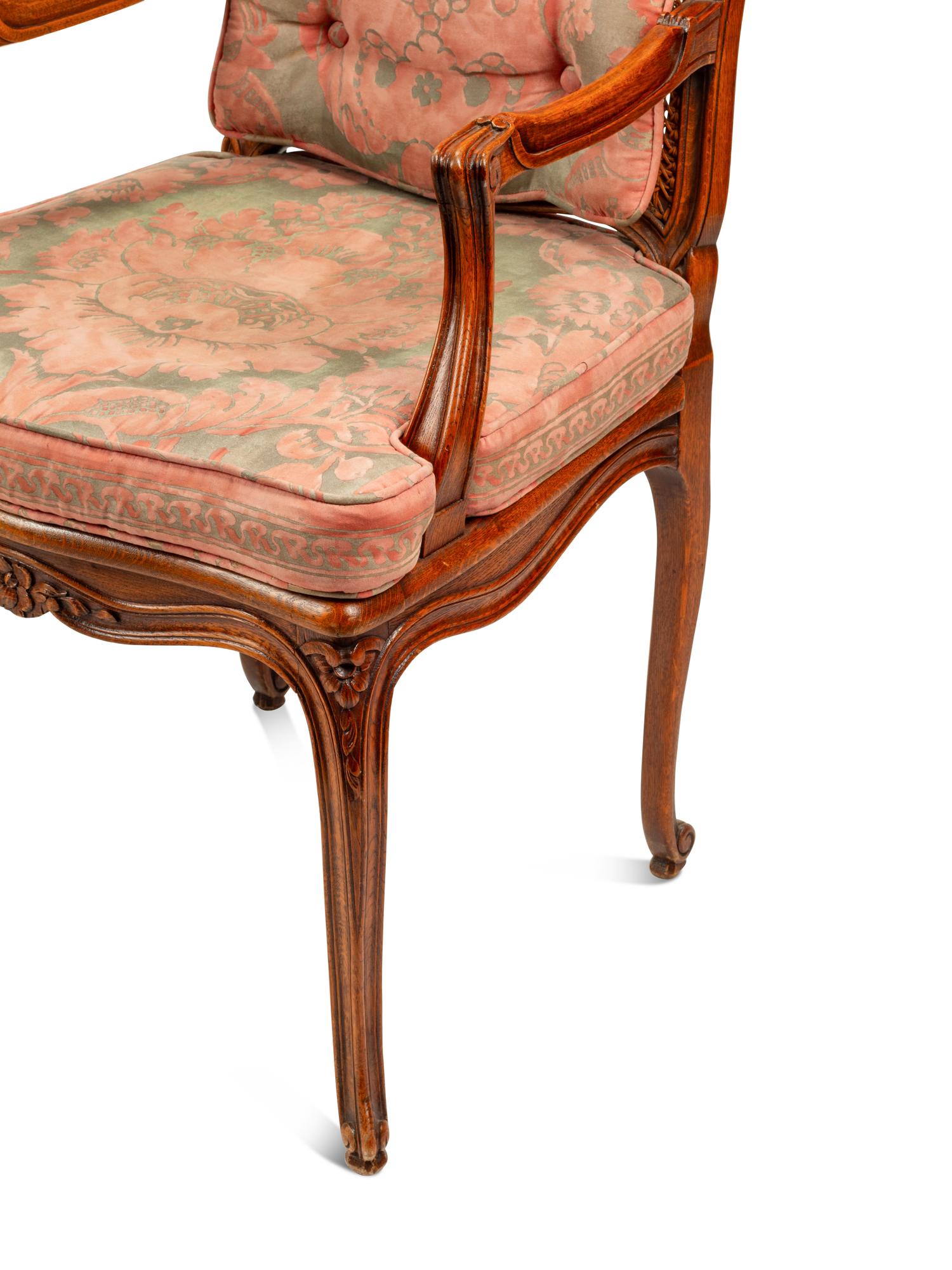 A Pair of Louis XV Style Oak Fauteuils