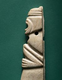 A Costa Rican White Jade Axe Pendant of a Crouching Monkey