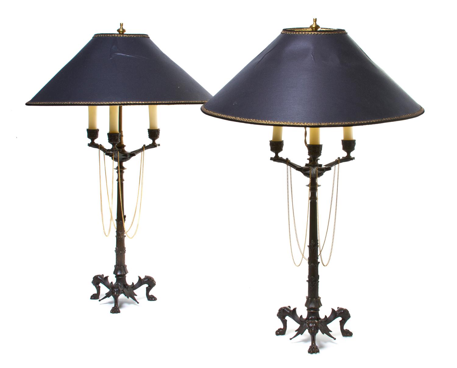 A Pair of Neoclassical Bronze Three-Light Candelabra, Height 26 1/2 inches.