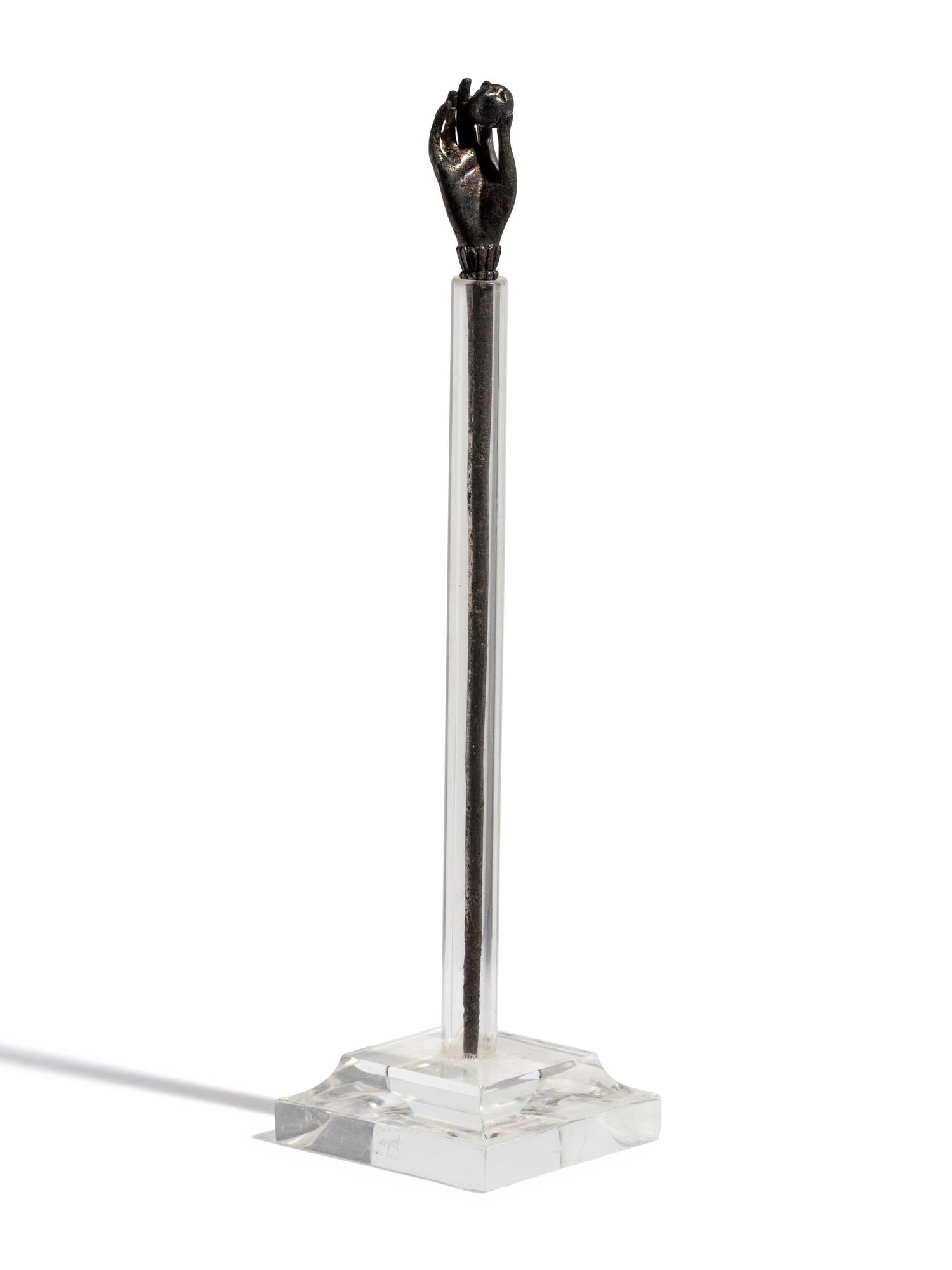 A Roman Silver Stickpin with a Hand and Pomegranate Finial