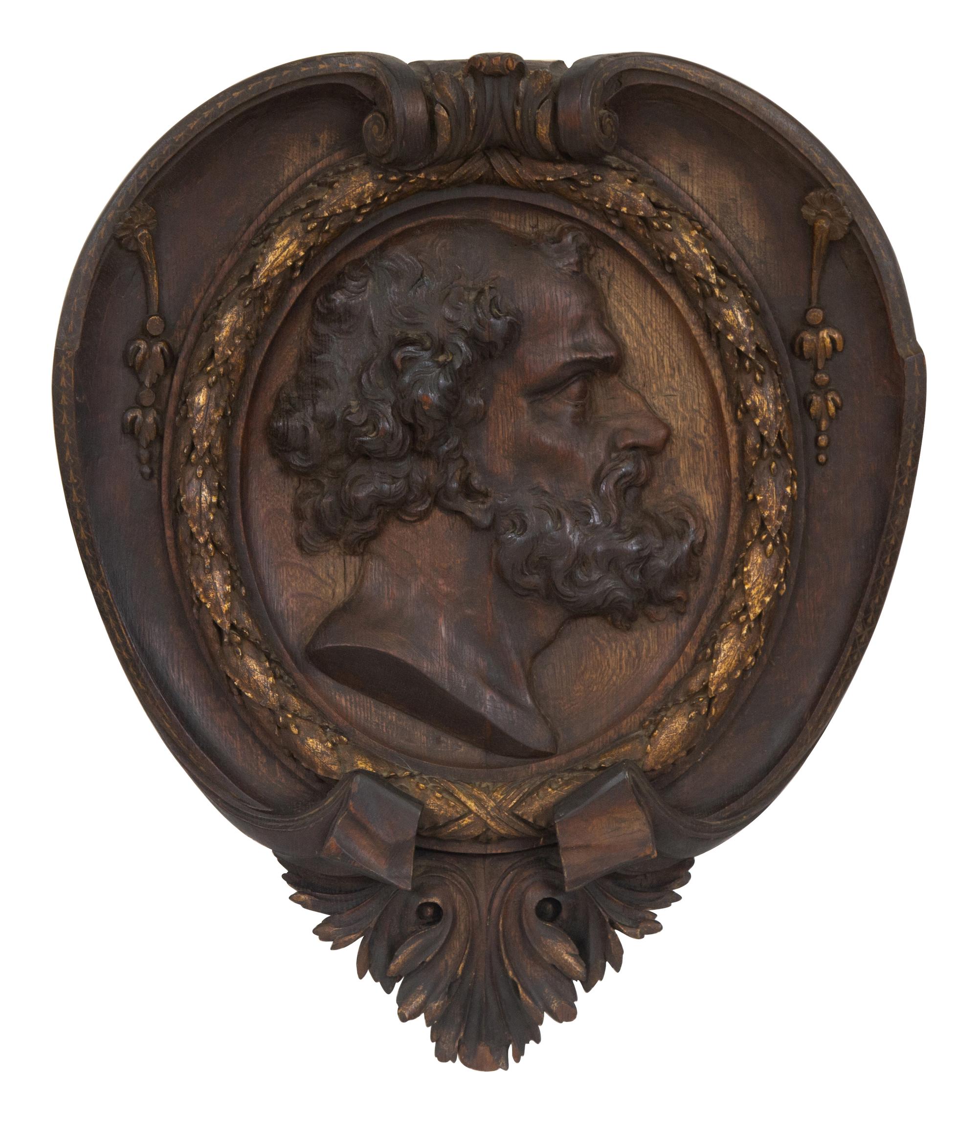 A Pair of Continental Carved Oak and Parcel Gilt Profile Plaques
