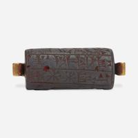 A Babylonian carved hematite cylindrical seal second millenium B.C.