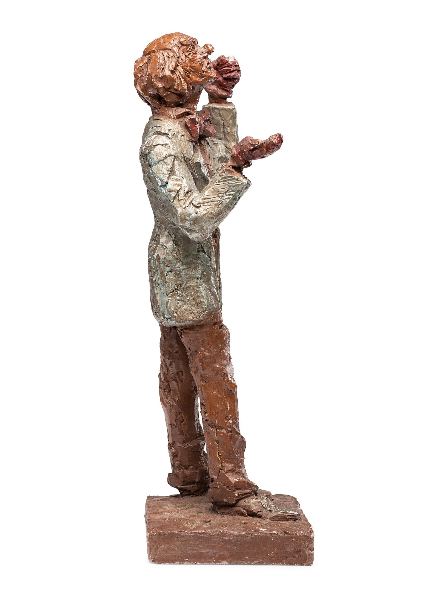 A Carved and Painted Plaster Folk Art Sculpture of a Standing Man