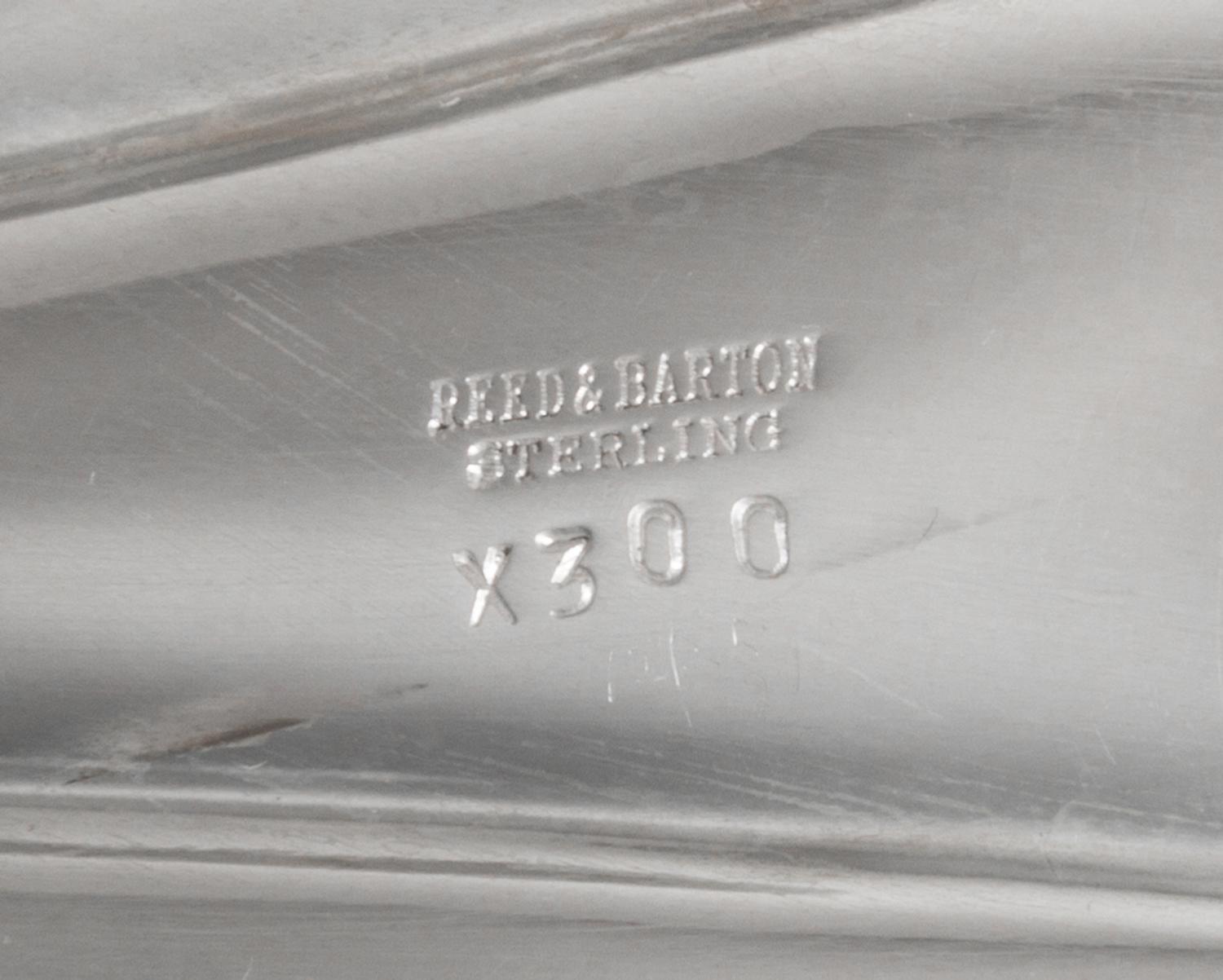 An American Silver Bowl, Reed & Barton, Taunton, MA, of elongated shell form with four spherical feet.