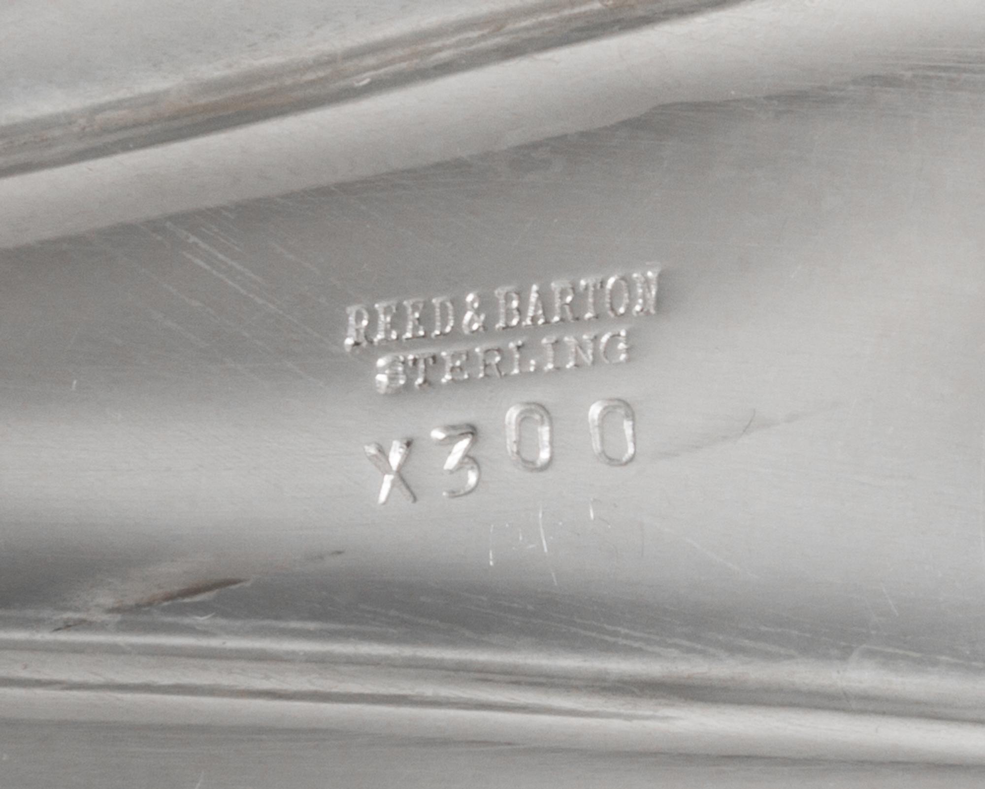 An American Silver Bowl, Reed & Barton, Taunton, MA, of elongated shell form with four spherical feet.