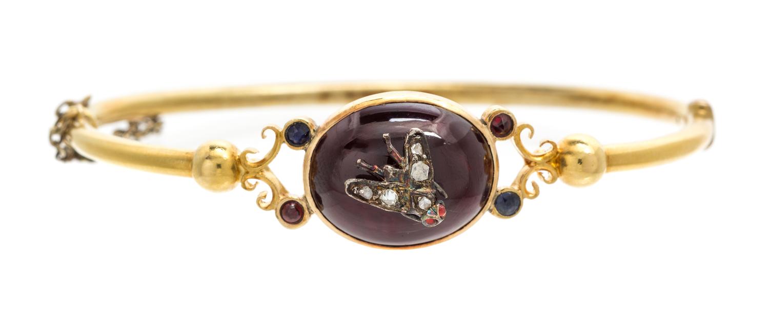 A Victorian Yellow Gold, Garnet, Sapphire, Ruby and Diamond Bangle Bracelet, 6.50 dwts.