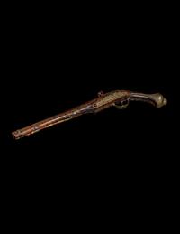 An Engraved Brass-Mounted Flintlock Pistol