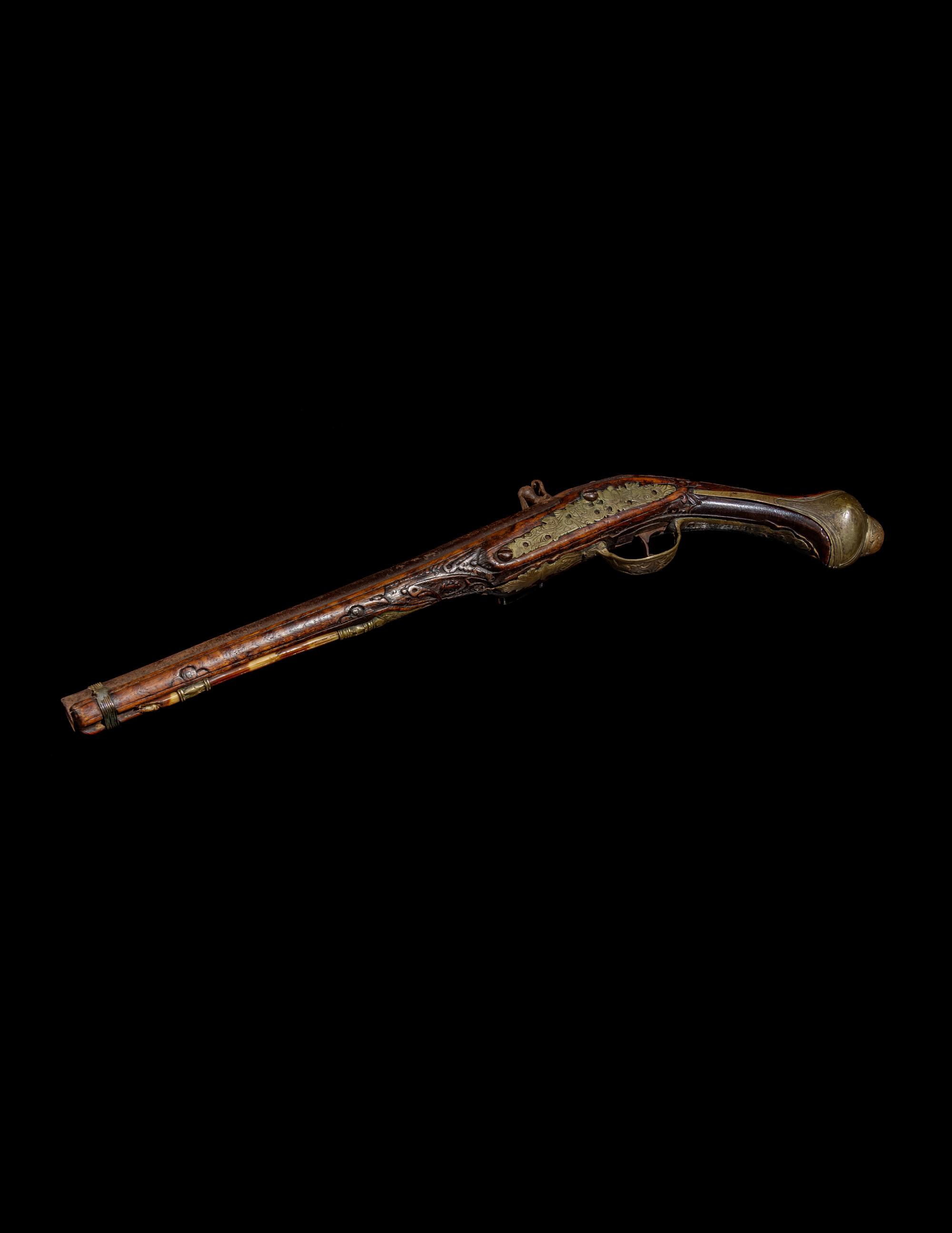 An Engraved Brass-Mounted Flintlock Pistol