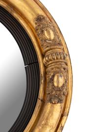 A Classical Carved Giltwood and Gesso Bull's Eye Mirror