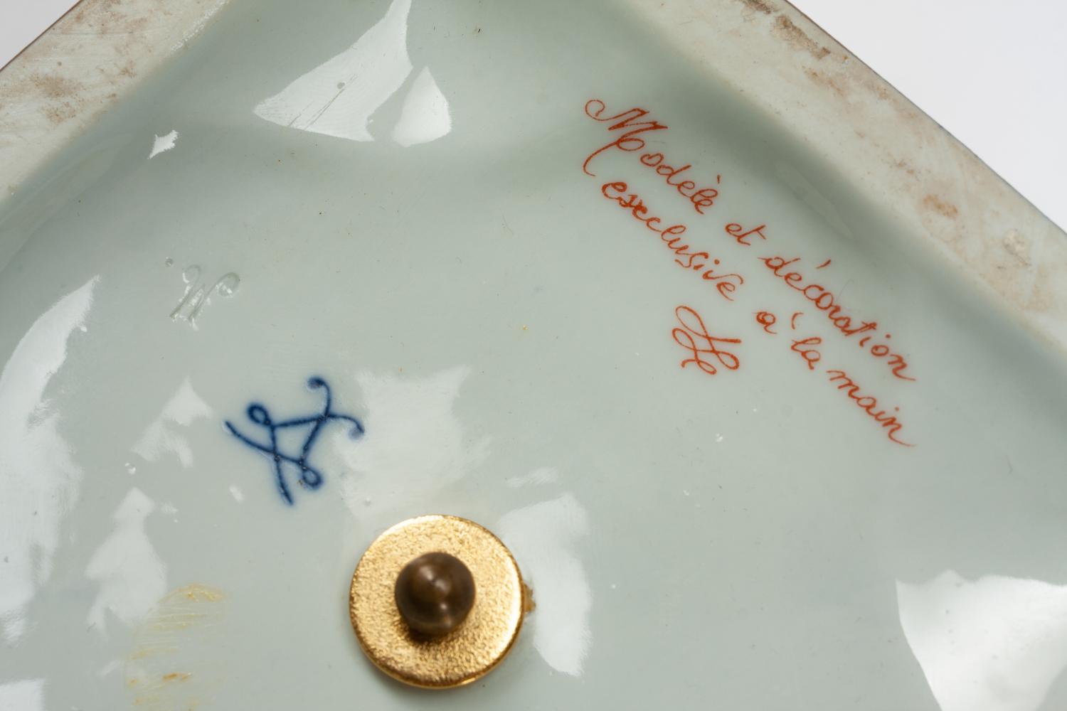 A Pair of French Porcelain Covered Urns