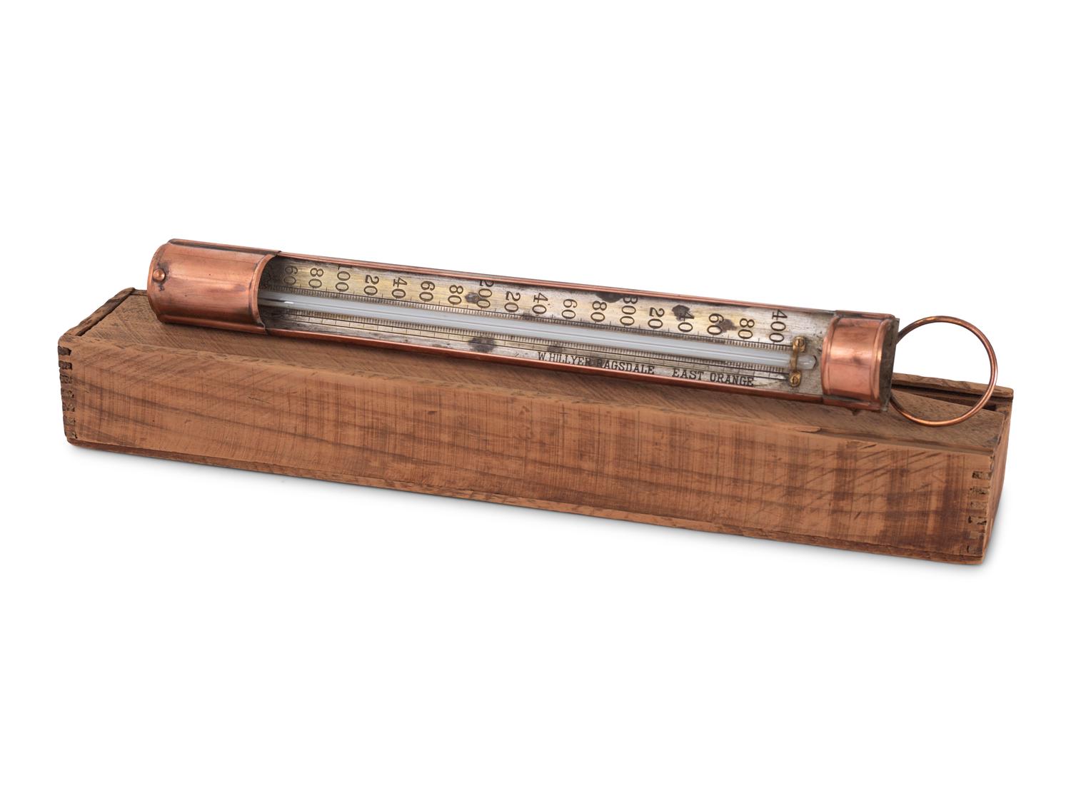 A Copper Tycos Candy Thermometer and a Wood Encased Floating Bath or Dairy Thermometer