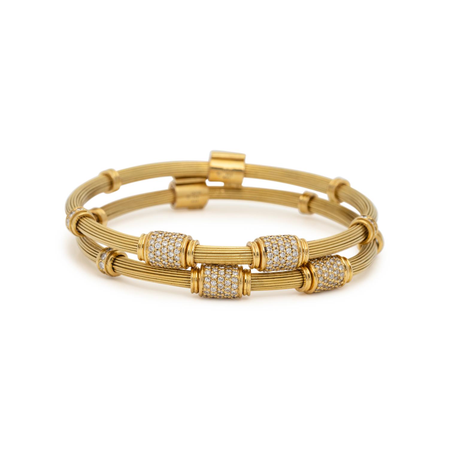 PAIR OF YELLOW GOLD AND DIAMOND BANGLE BRACELETS