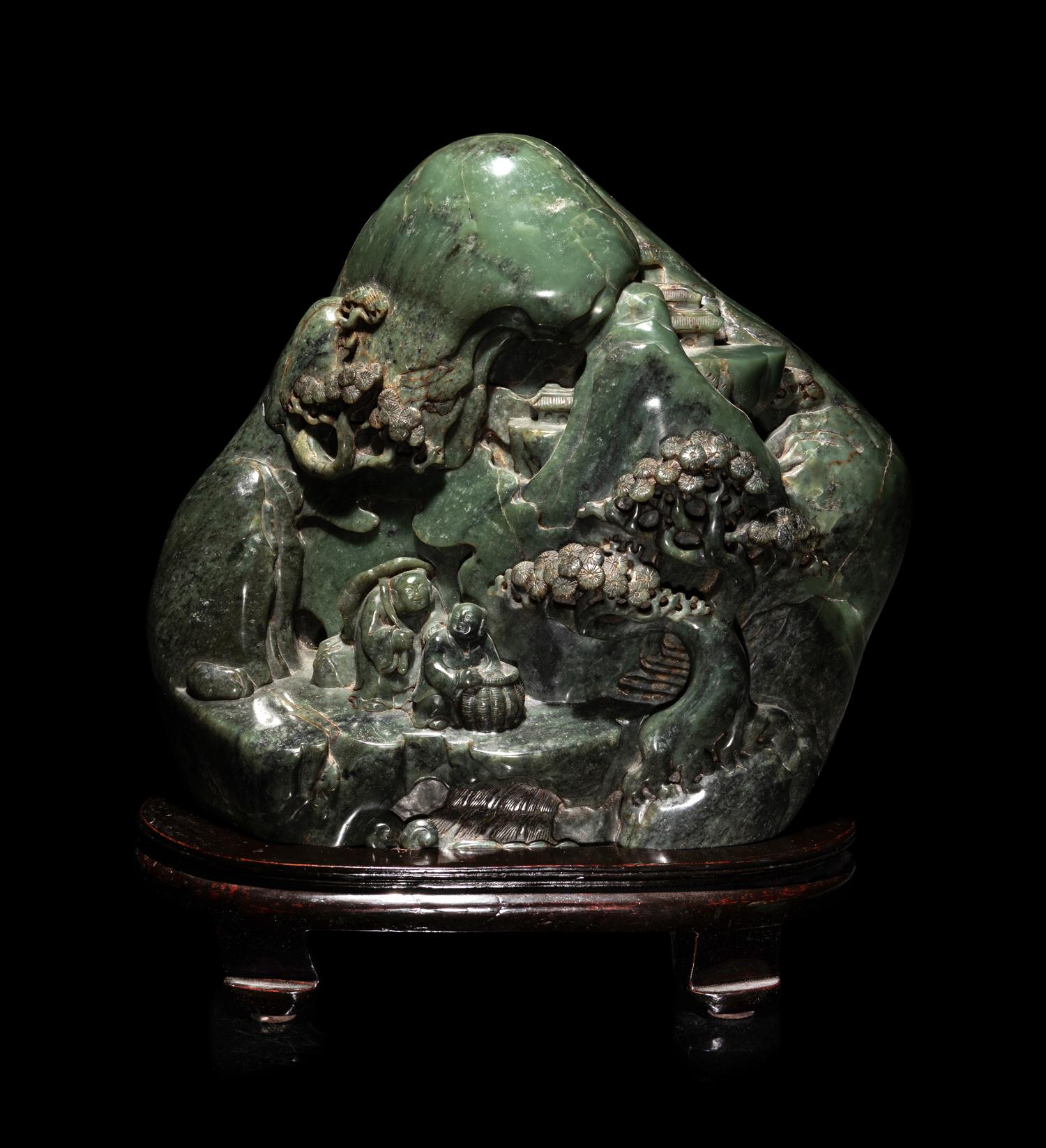 A Chinese Carved Spinach Jade 'Landscape' Boulder