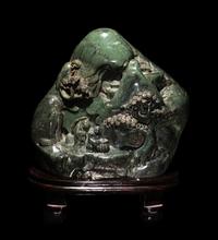 A Chinese Carved Spinach Jade 'Landscape' Boulder