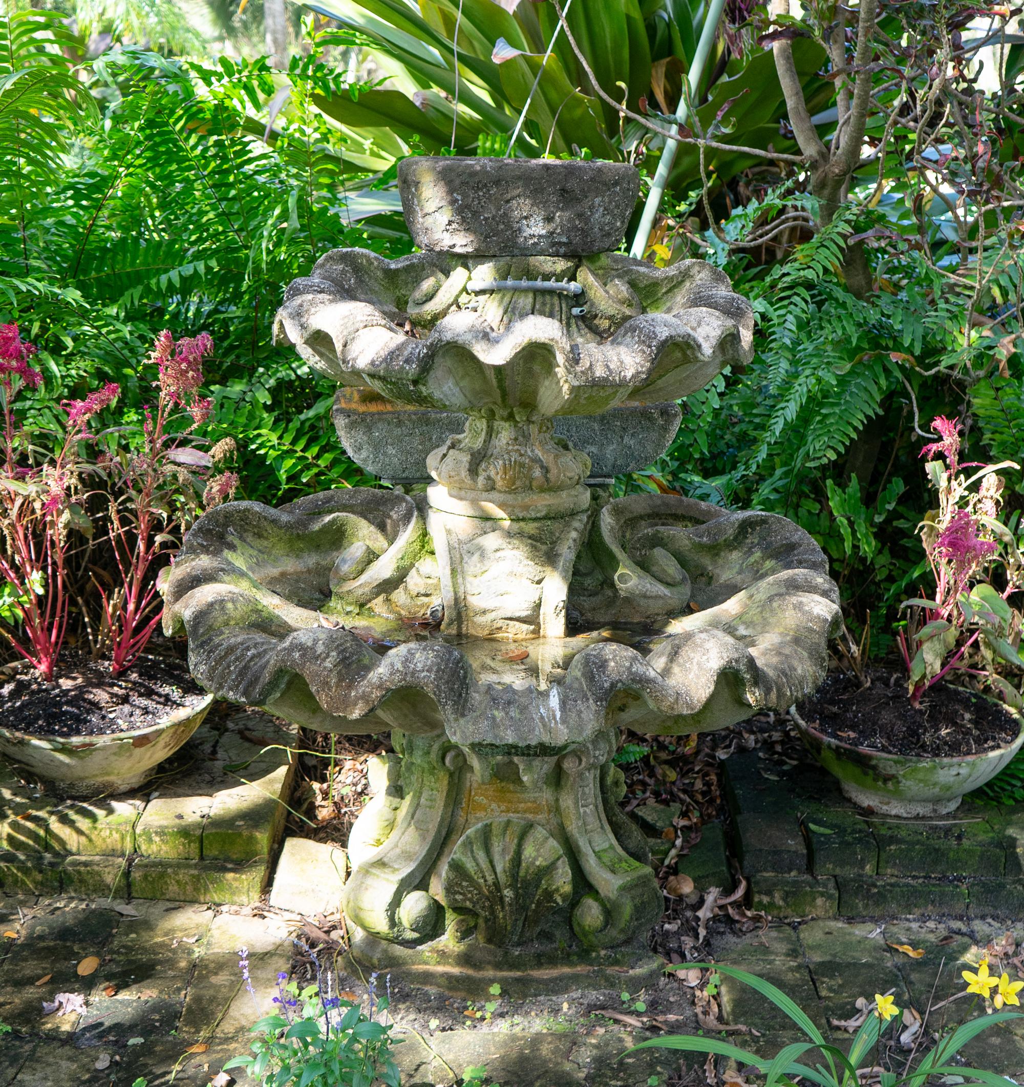 A Carved Stone Two Tier Shell Water Fountain