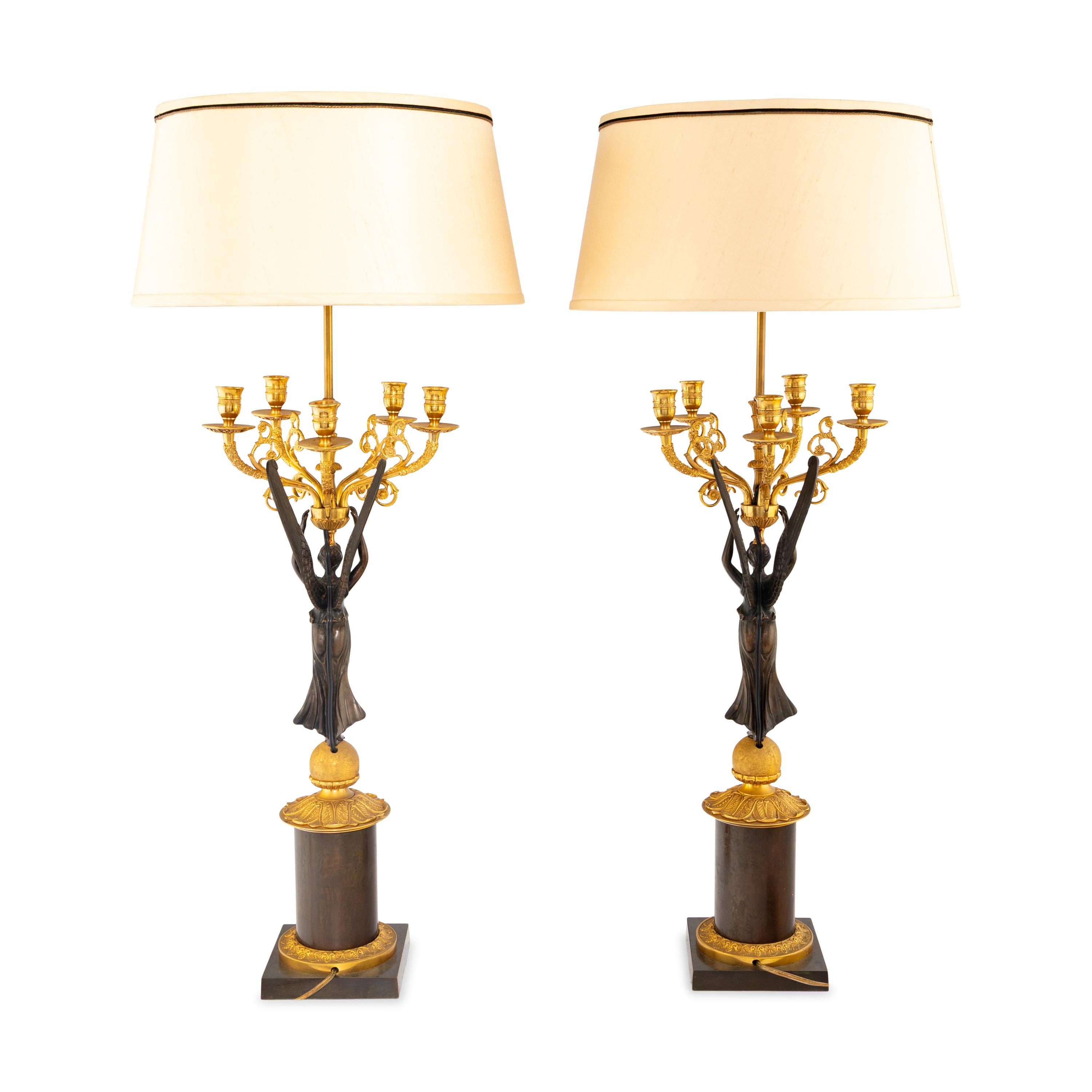 A Pair of Empire Style Gilt and Patinated Bronze Candelabra Mounted as Lamps