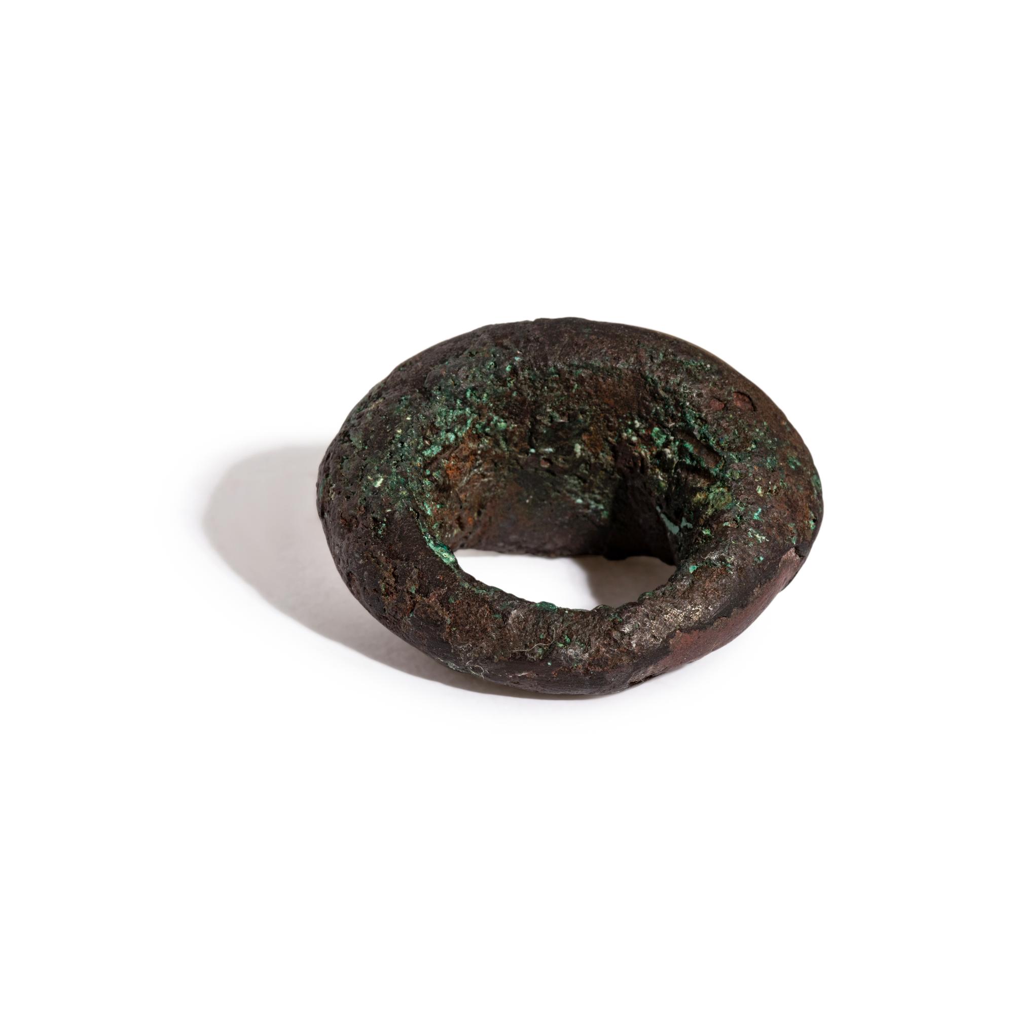 A Roman Copper Alloy and Chalcedony Finger Ring with the God Apollo