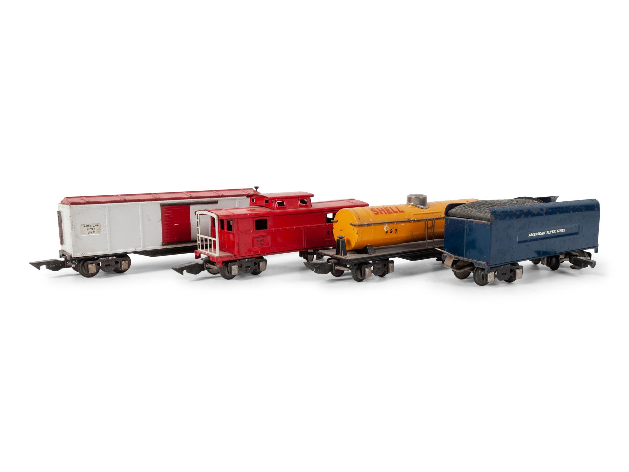 A Lionel 385E Loco Engine and Tender, Three Lionel Train Cars, Four American Flyer Line Cars and Other Accessories