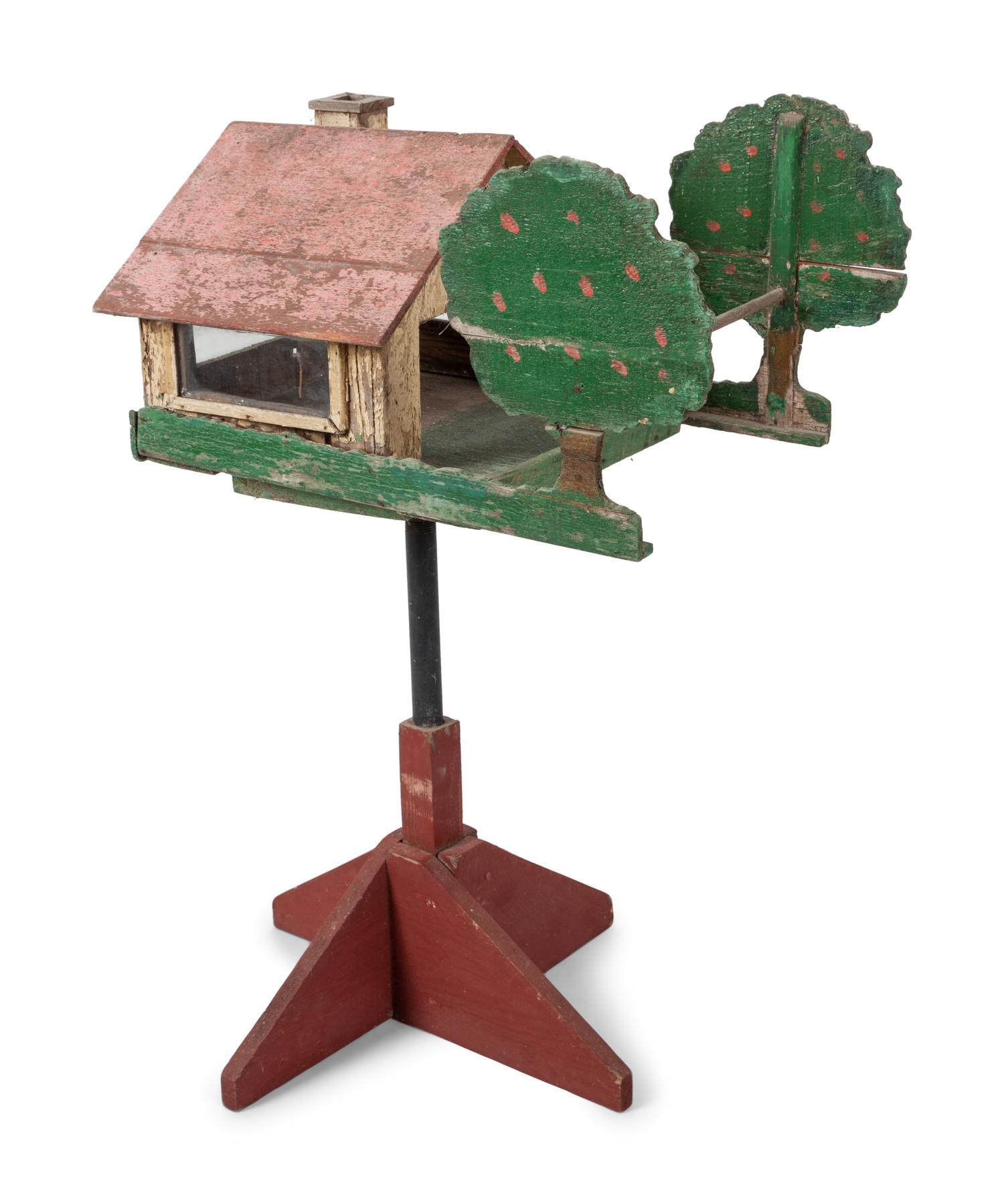 A Carved and Painted Wood Directional Tree and House Bird Feeder