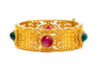HIGH KARAT GOLD AND SYNTHETIC GEMSTONE BANGLE BRACELET