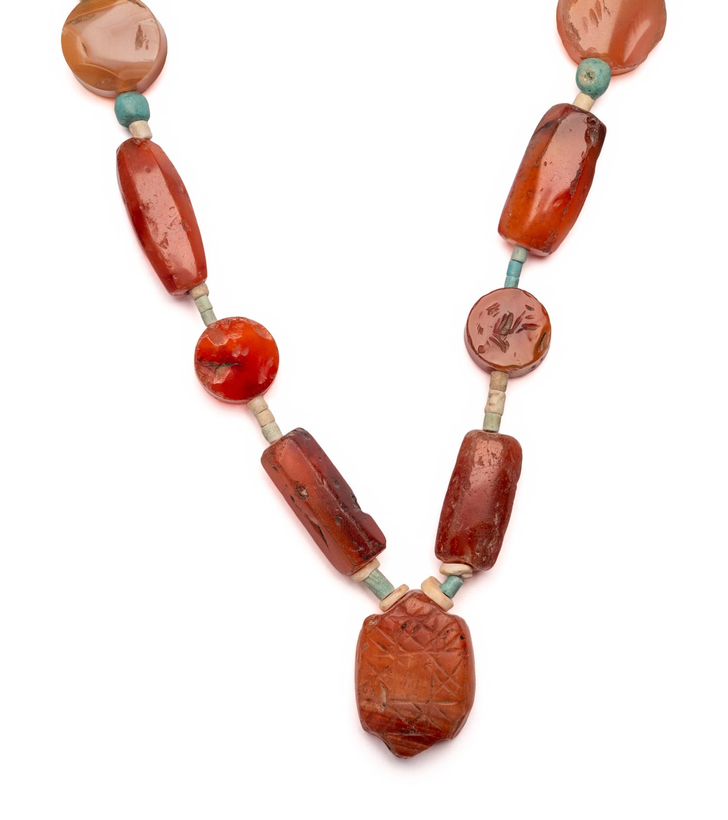 An Egyptian Carnelian and Faience Necklace