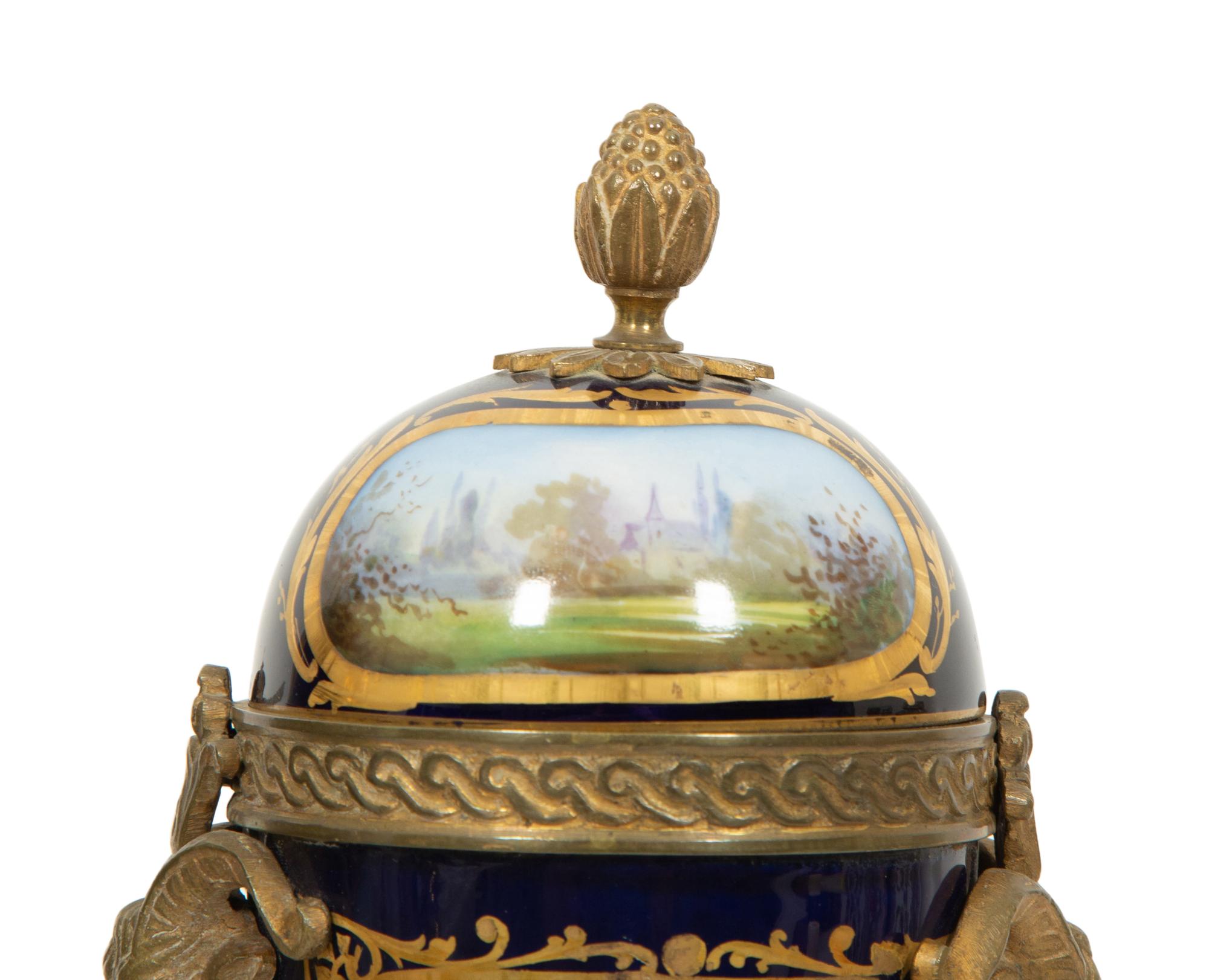 A Pair of Gilt Bronze Mounted Sevres Style Porcelain Urns