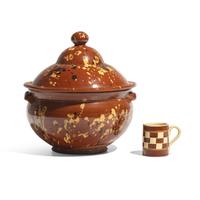 A Glazed and Slip-Decorated Redware Covered Tureen and a Checkered Yellowware Mug
