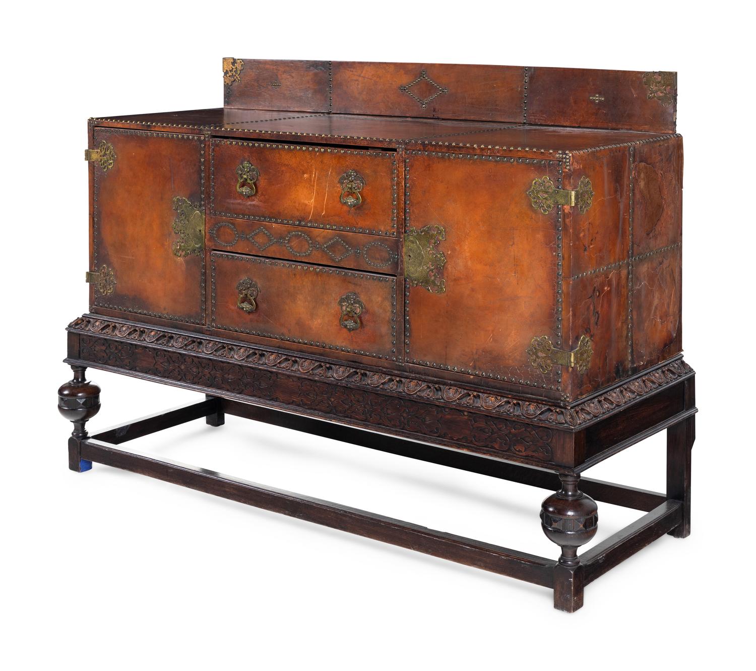 A Spanish Baroque Style Leather-Veneered Side Cabinet