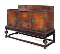 A Spanish Baroque Style Leather-Veneered Side Cabinet
