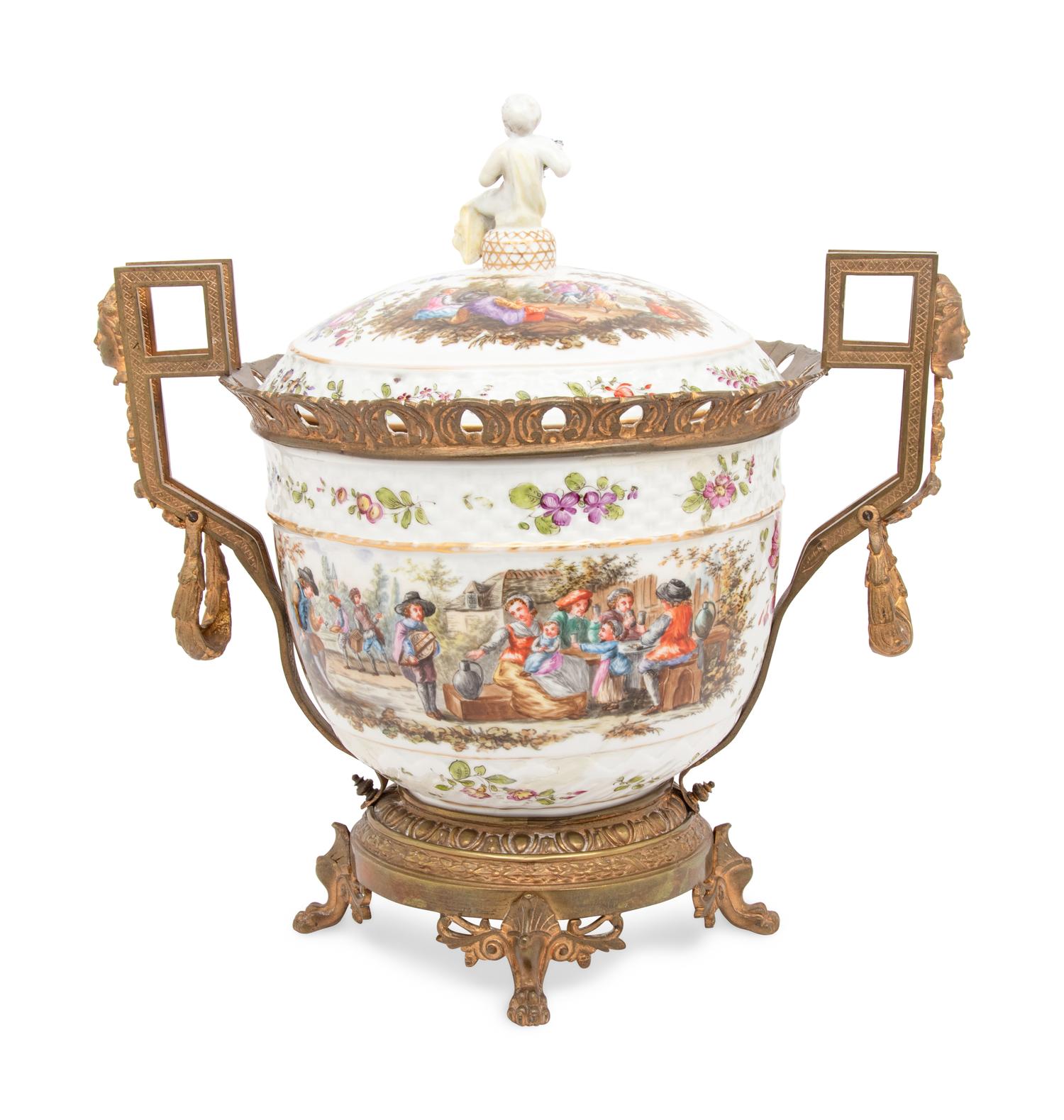 A Continental Gilt Metal Mounted Porcelain Covered Urn