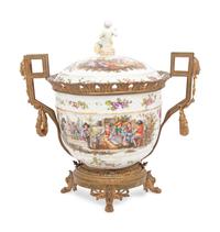 A Continental Gilt Metal Mounted Porcelain Covered Urn