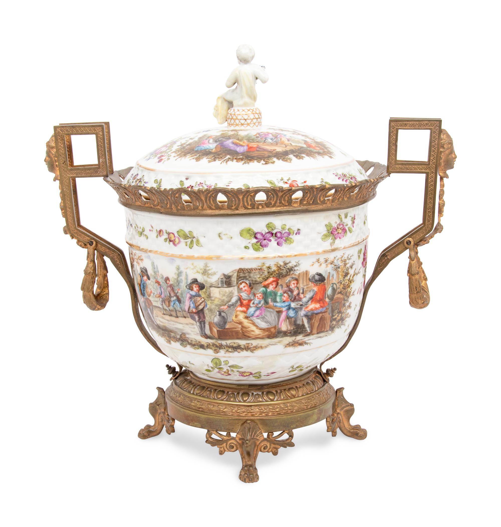 A Continental Gilt Metal Mounted Porcelain Covered Urn